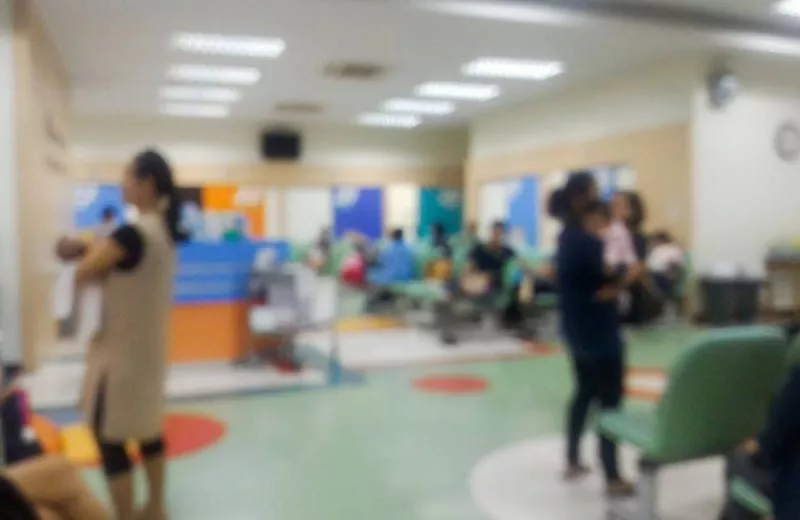 A busy pediatric waiting room with more patients than nurse practitioners.